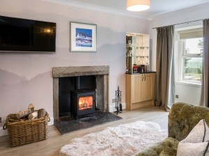 The Romantics Lounge with wood-burning stove and cocktail bar